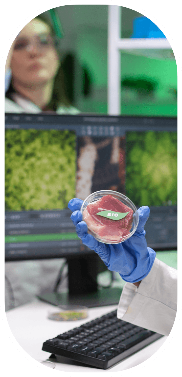 Scientist holding a lab-grown meat sample in a petri dish